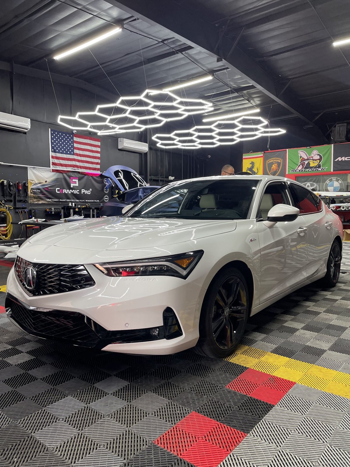 White Acura sedan detailed in the Obsidian studio