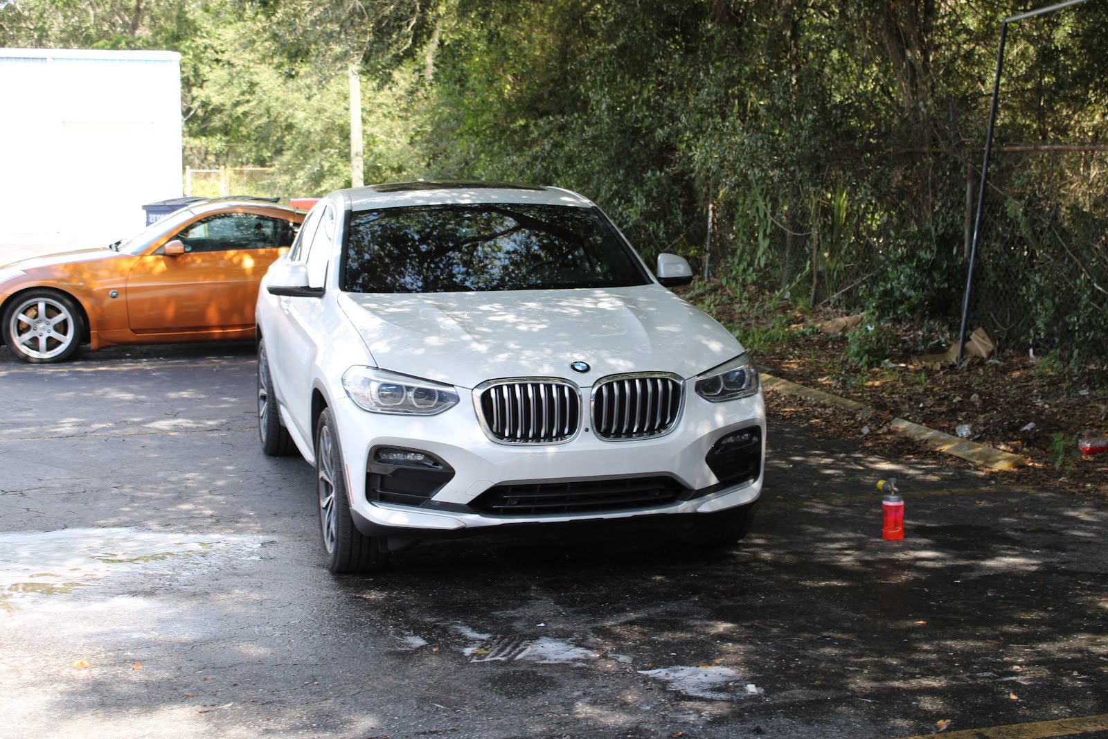 Detailed BMW X4 SUV after a mobile detail in a Towson driveway