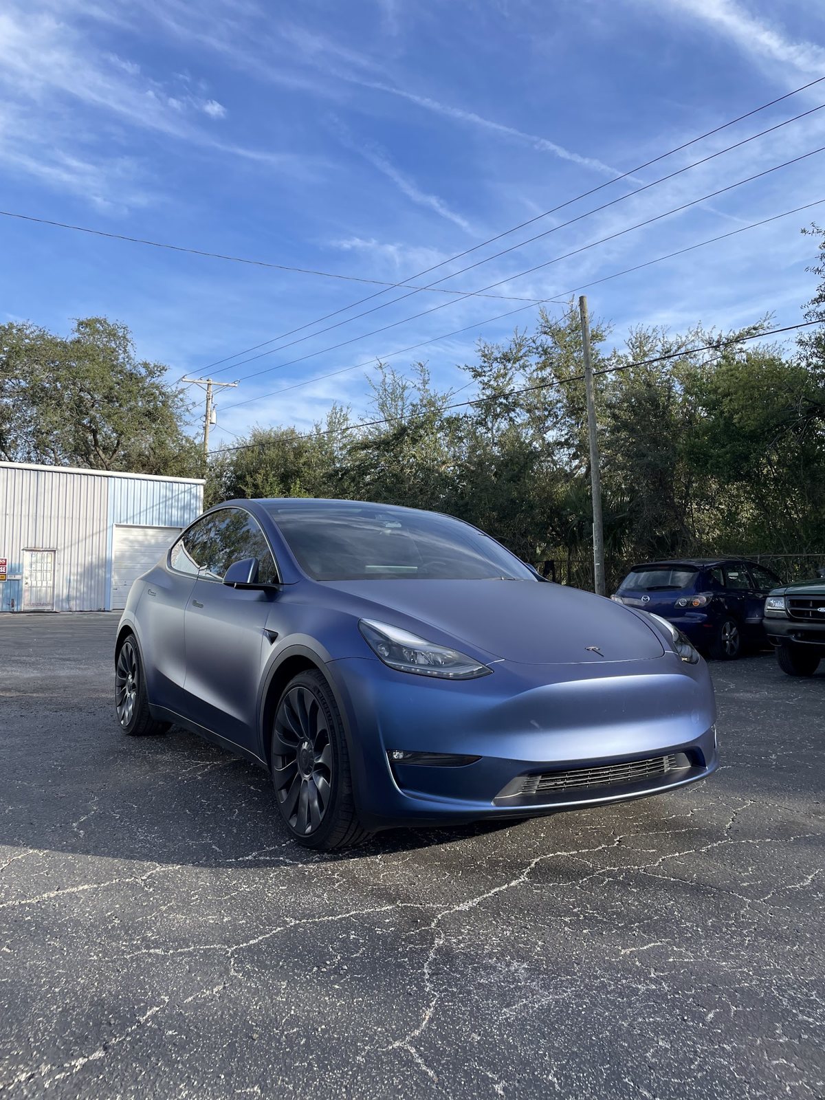 Blue Tesla Model Y detailed on-site in Baltimore